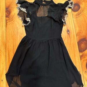 Elegant Black Mini Dress with Lace Accents